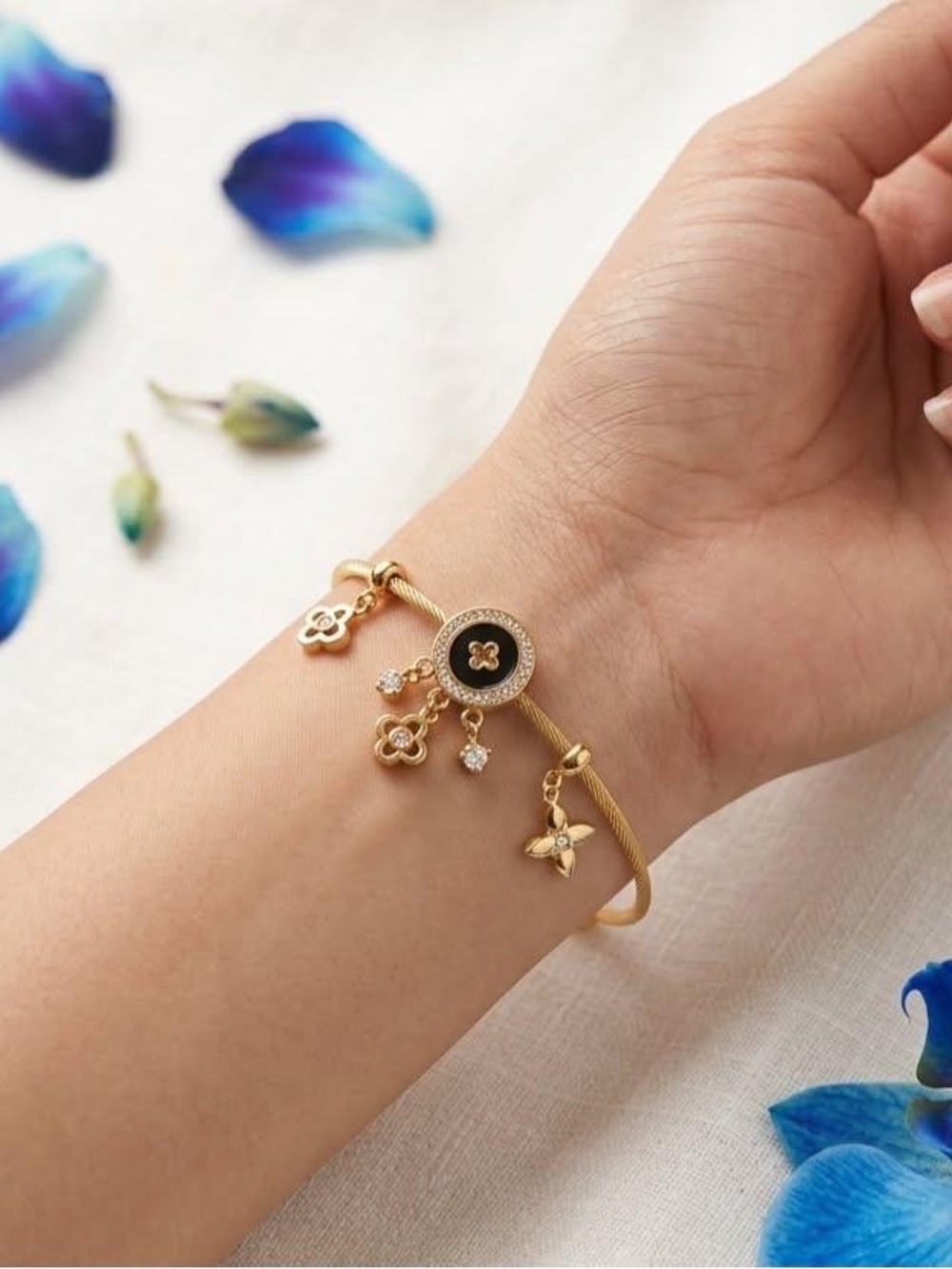 Gold Flower Charm Bracelet with Black Enamel Accent